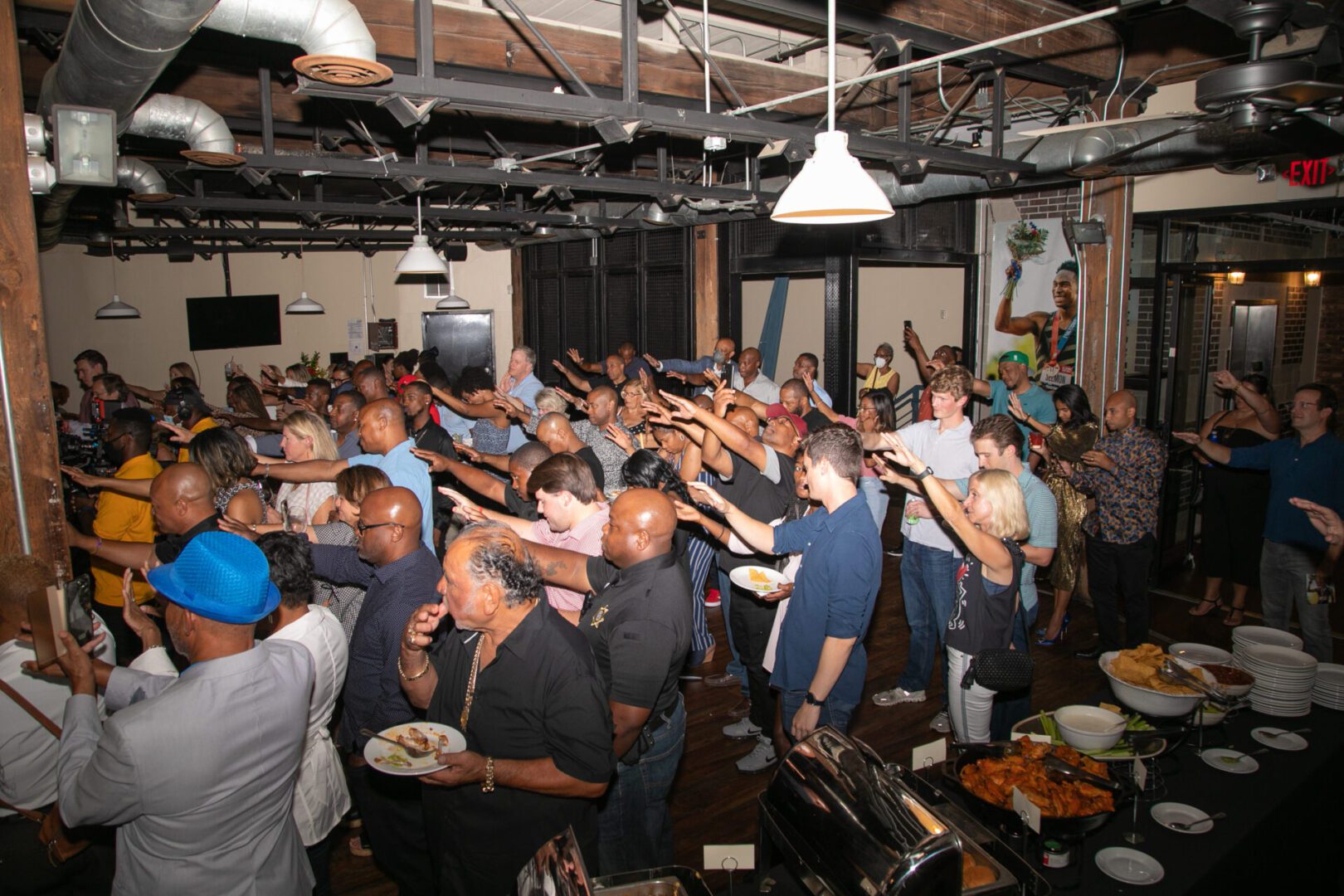 A group of people standing in a room.