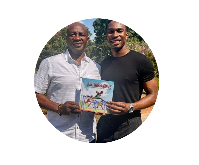 Two men holding a book in front of each other.